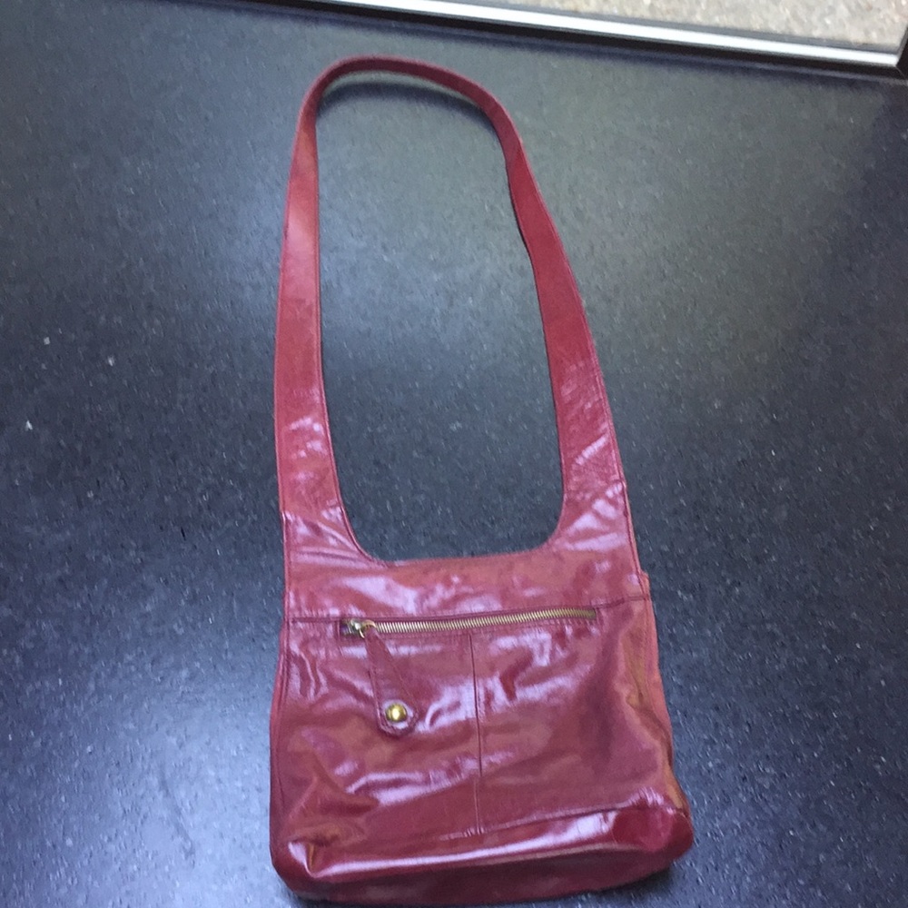 Raspberry colored leather HOBO cross body bag